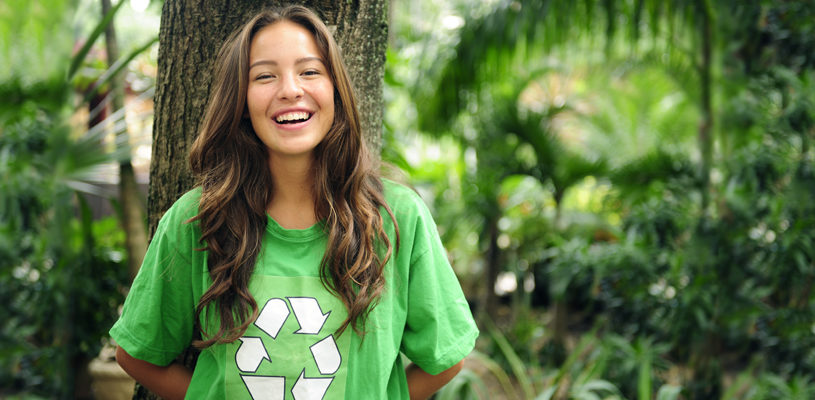 environmental activist  in the forest wearing recycle t-shirt