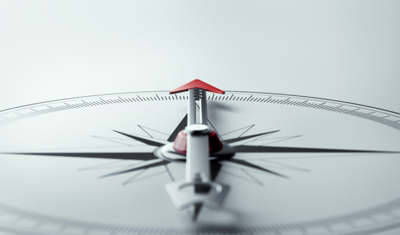 Compass on White Background with Selective Focus